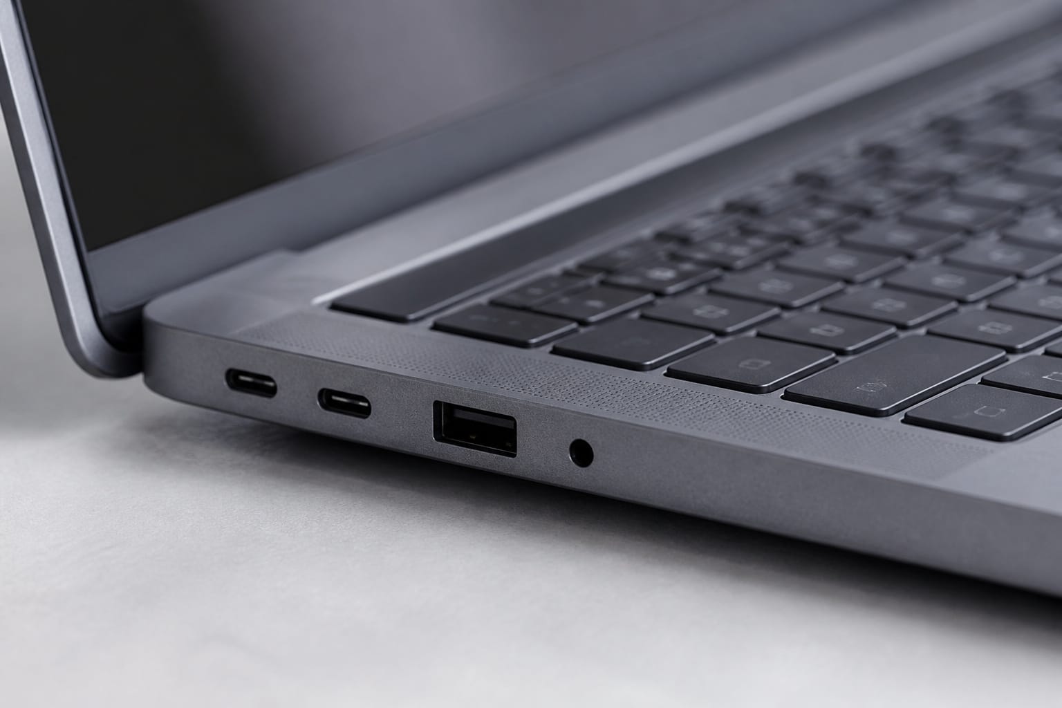 Close-up of a laptop keyboard and side ports
