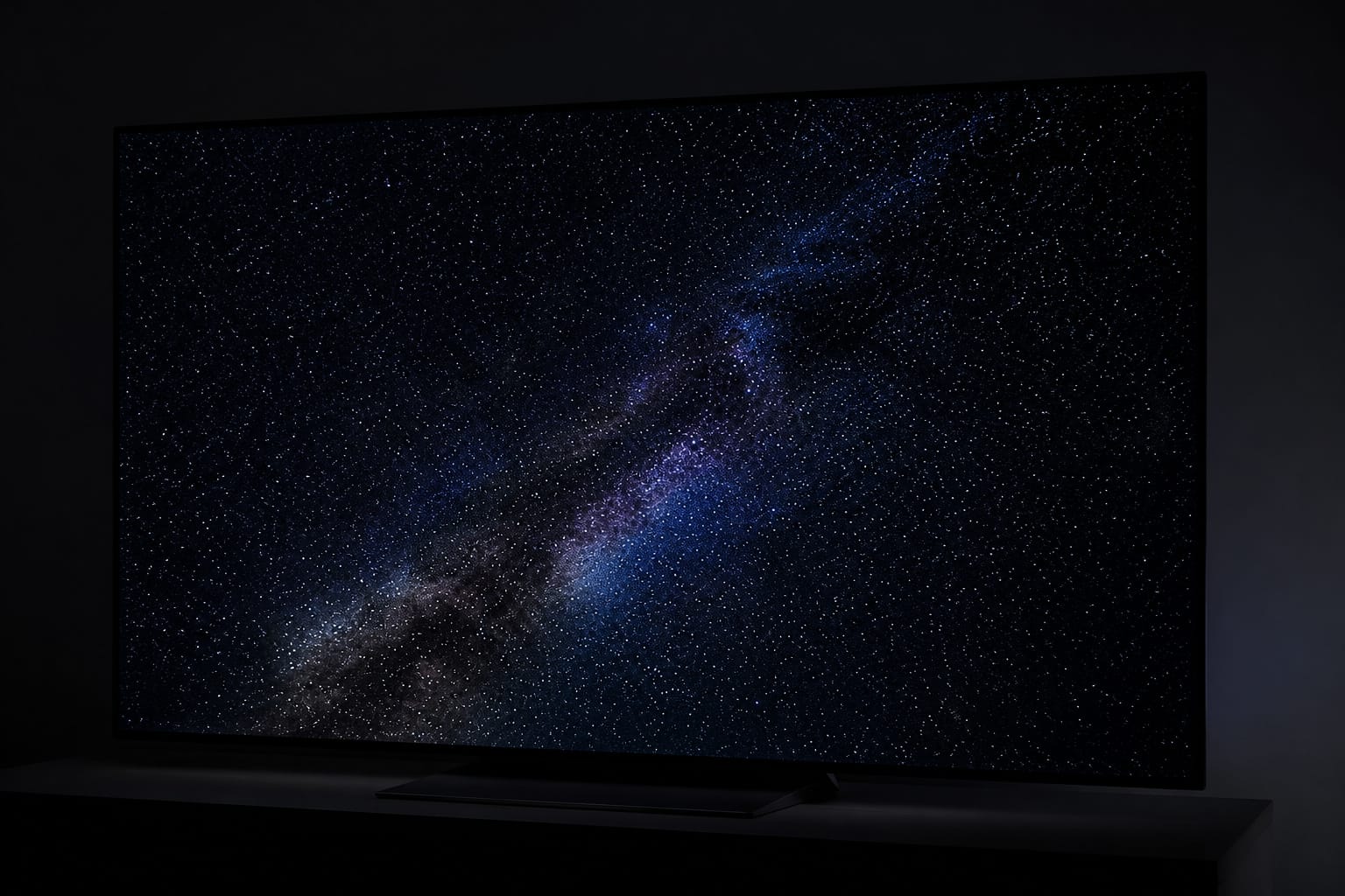 OLED TV showing a starry night sky with deep blacks