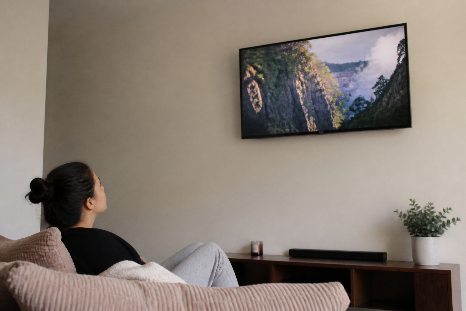 Person looking up at a TV mounted too high