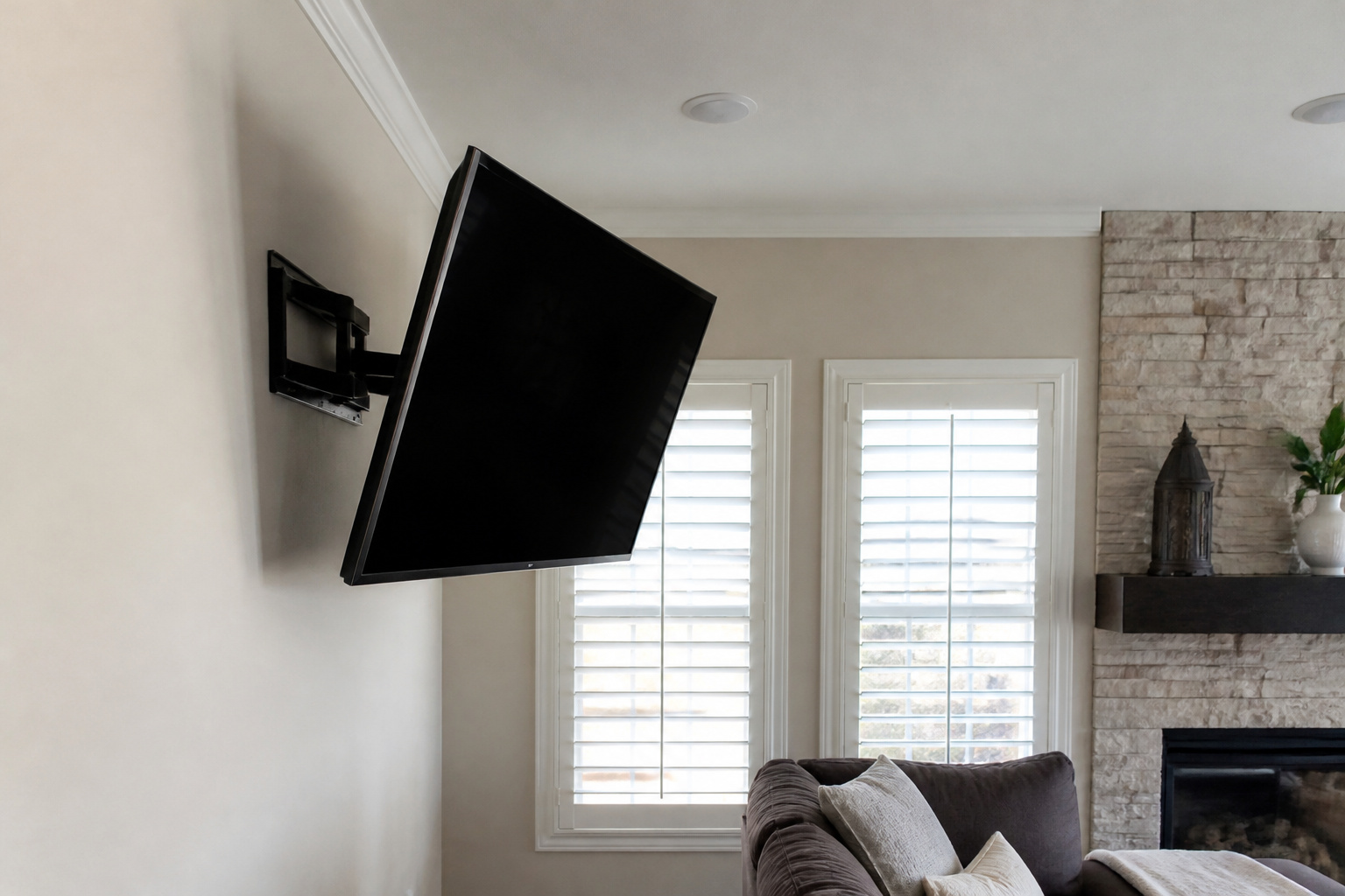 TV on a tilting mount angled toward the seating area