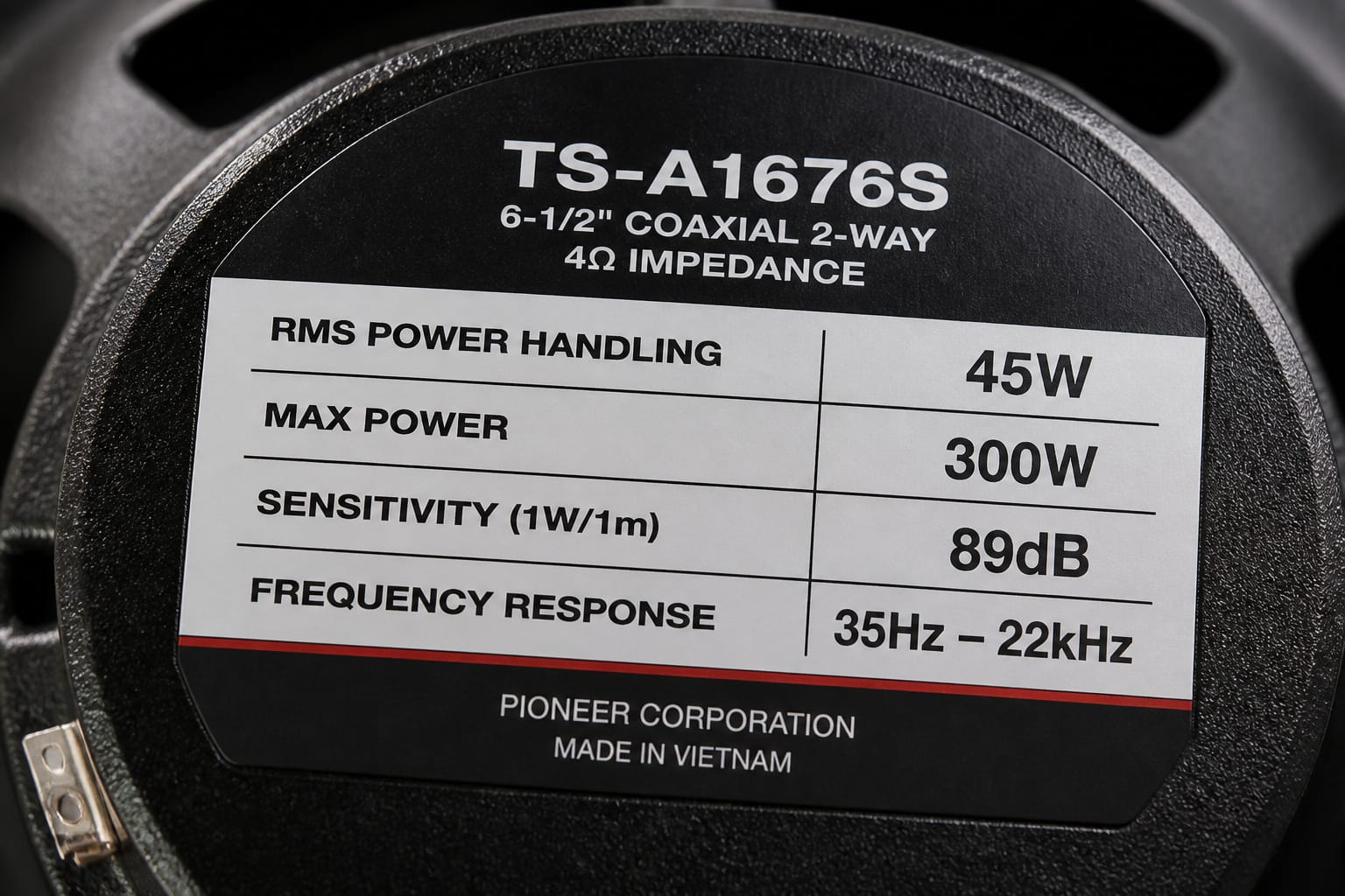 Car speaker specification label showing RMS power handling and sensitivity rating