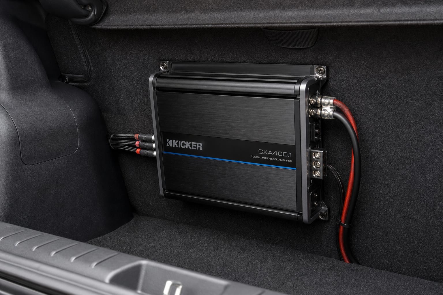 Compact Class D car amplifier mounted in a vehicle's trunk