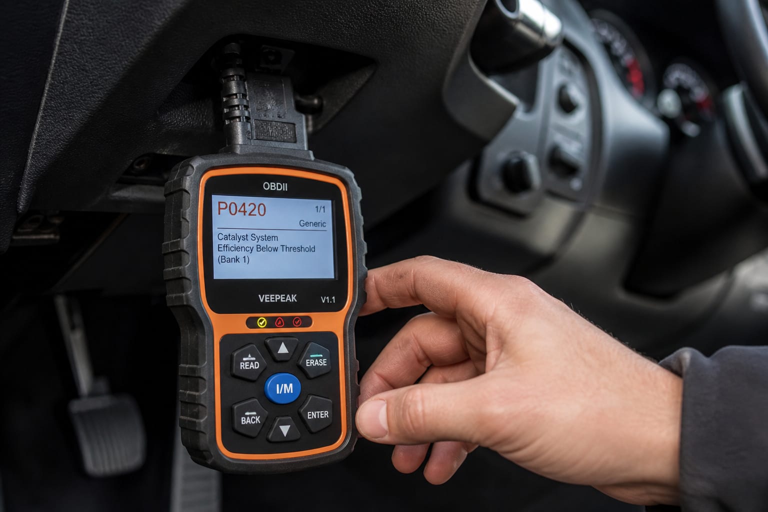 OBD2 scanner plugged in and displaying a trouble code inside a car