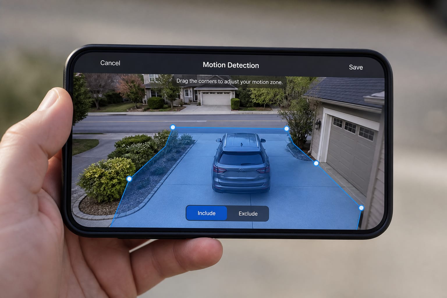 Security camera app showing a motion detection activity zone overlaid on a driveway