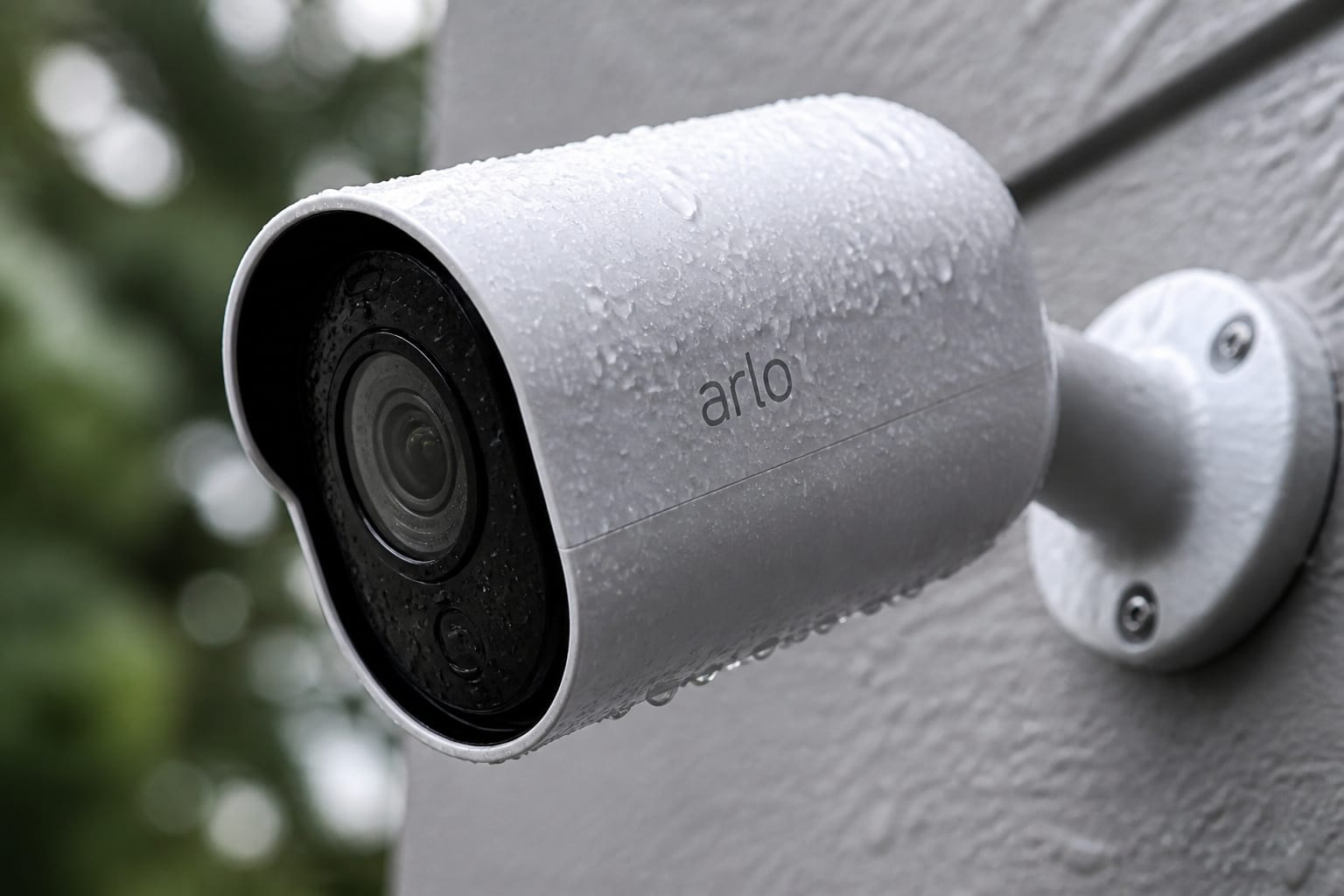 Rain beading off the weatherproof housing of an outdoor security camera