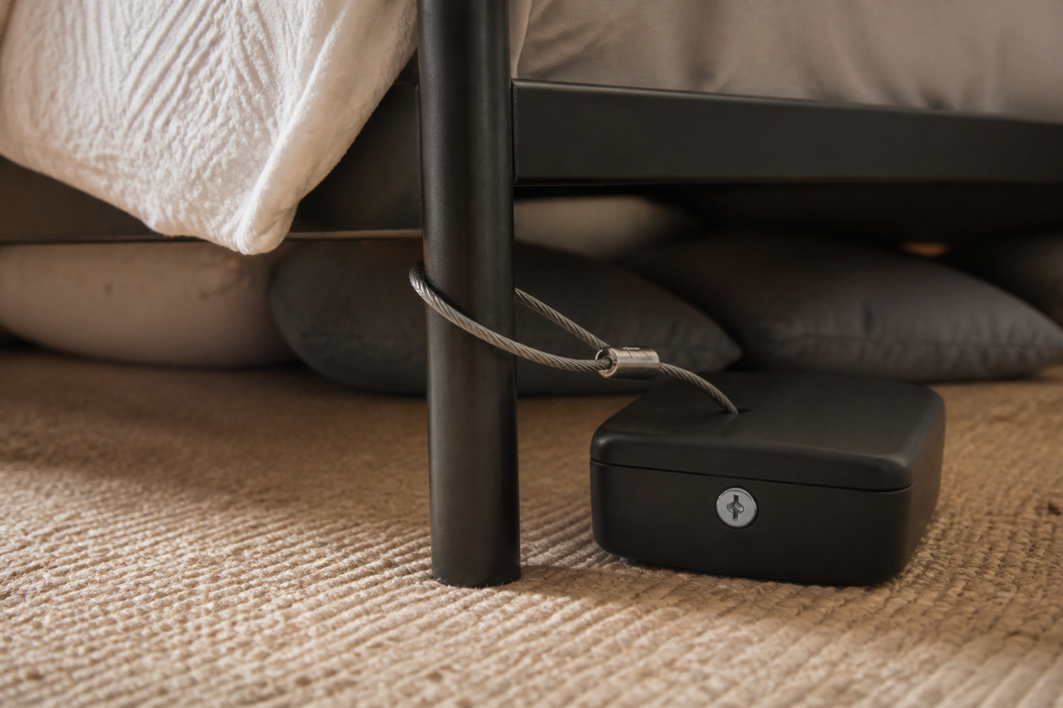 Portable lockbox tethered with a cable
