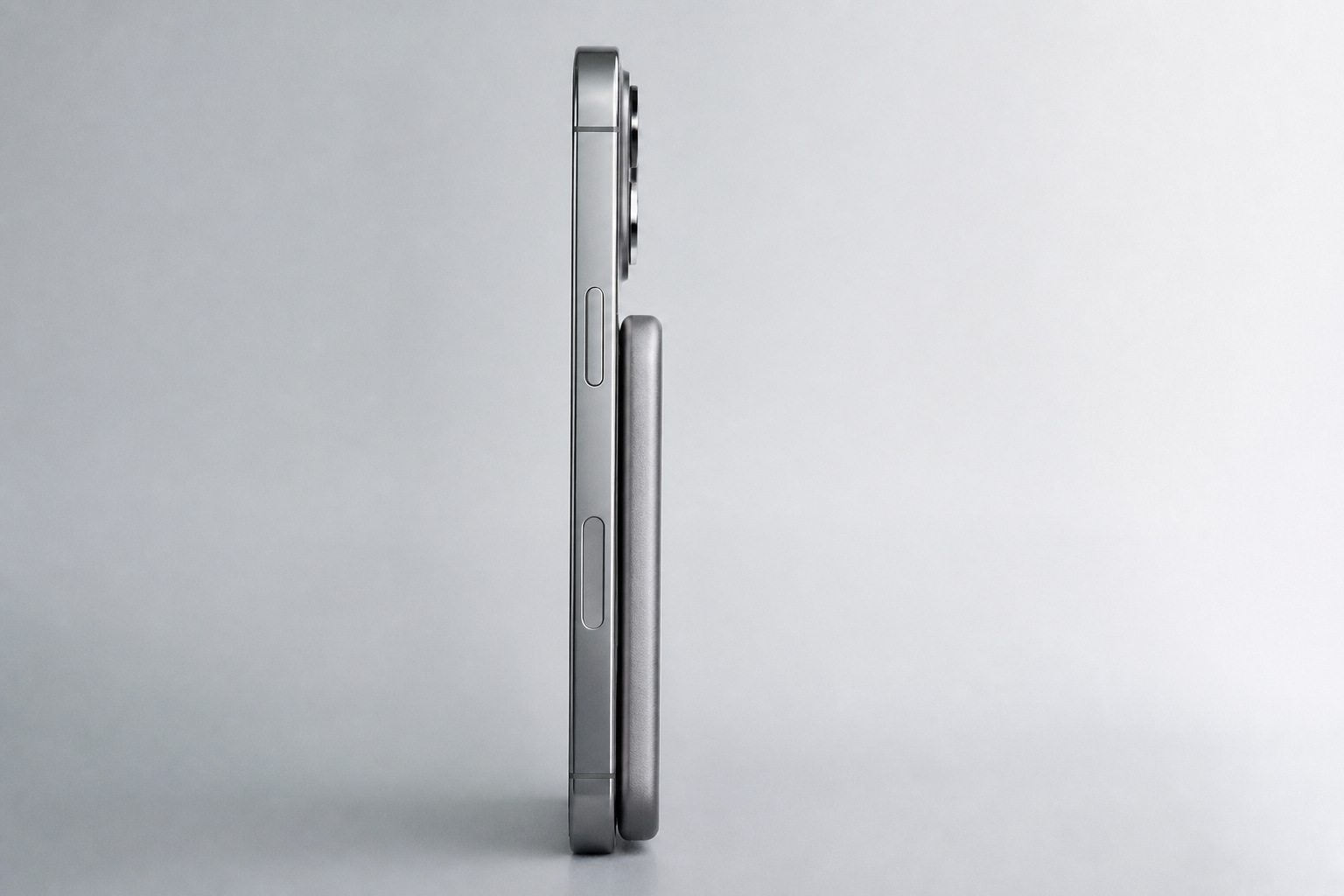 Side view of a very thin magnetic power bank attached to a phone