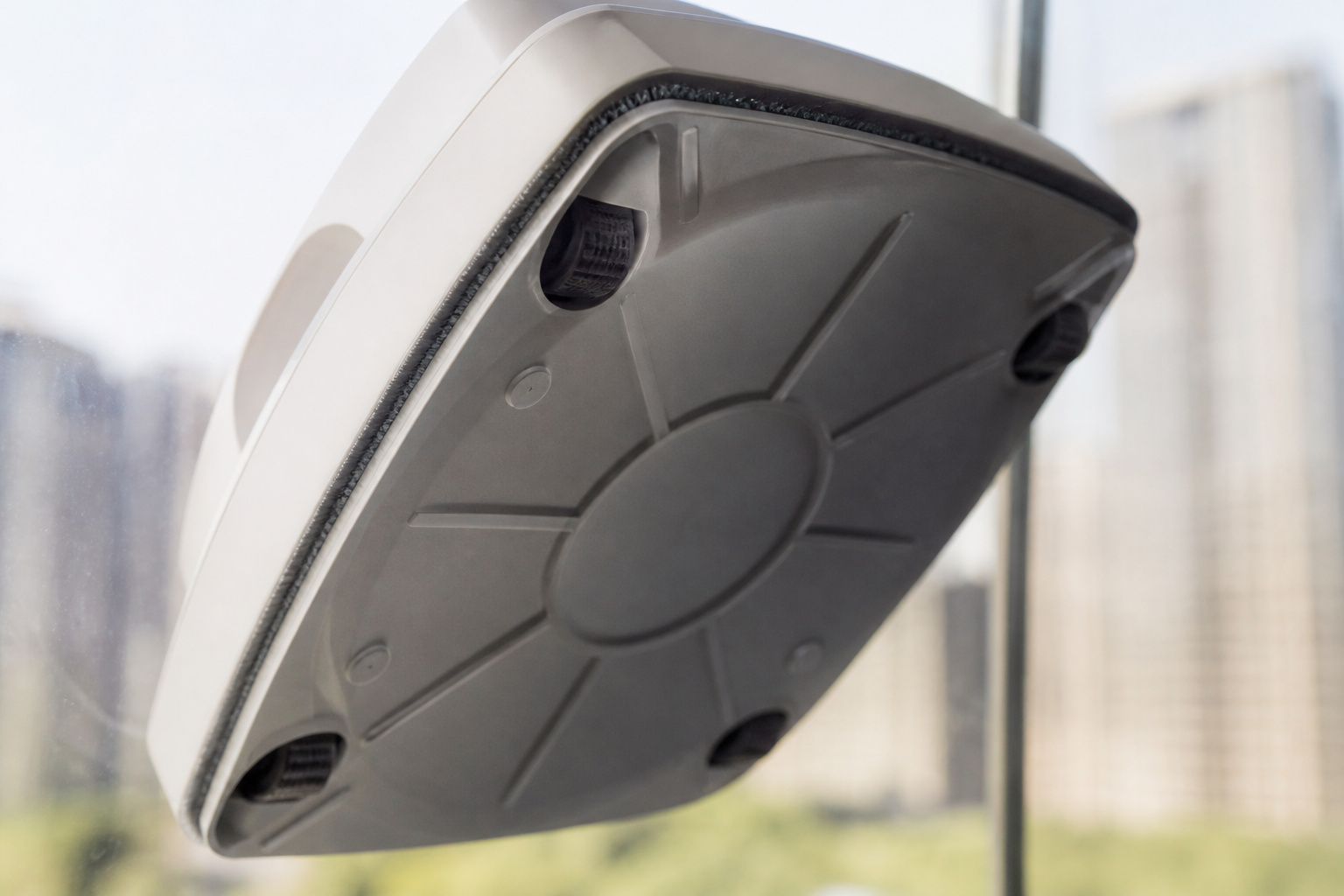 Close-up of a window robot's suction base on glass