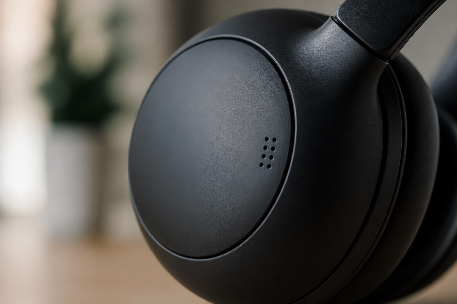 Microphone openings on a noise cancelling headphone cup