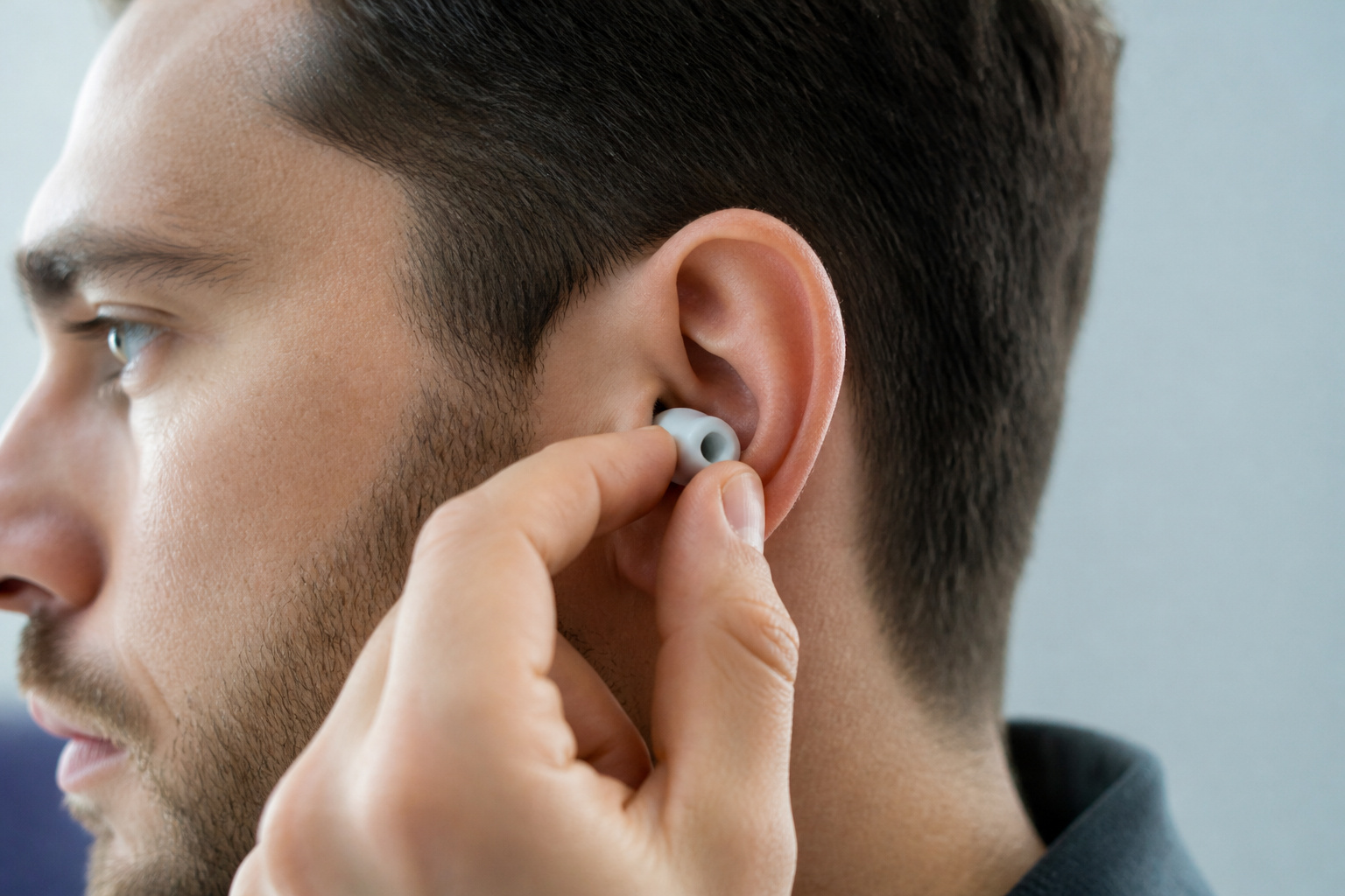 Inserting a silicone earbud tip for a good seal