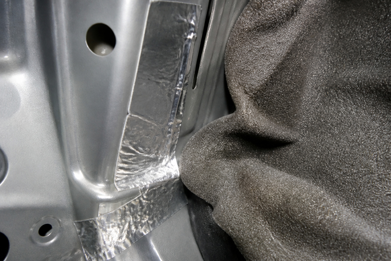 Aluminum tape and foam inside a car door
