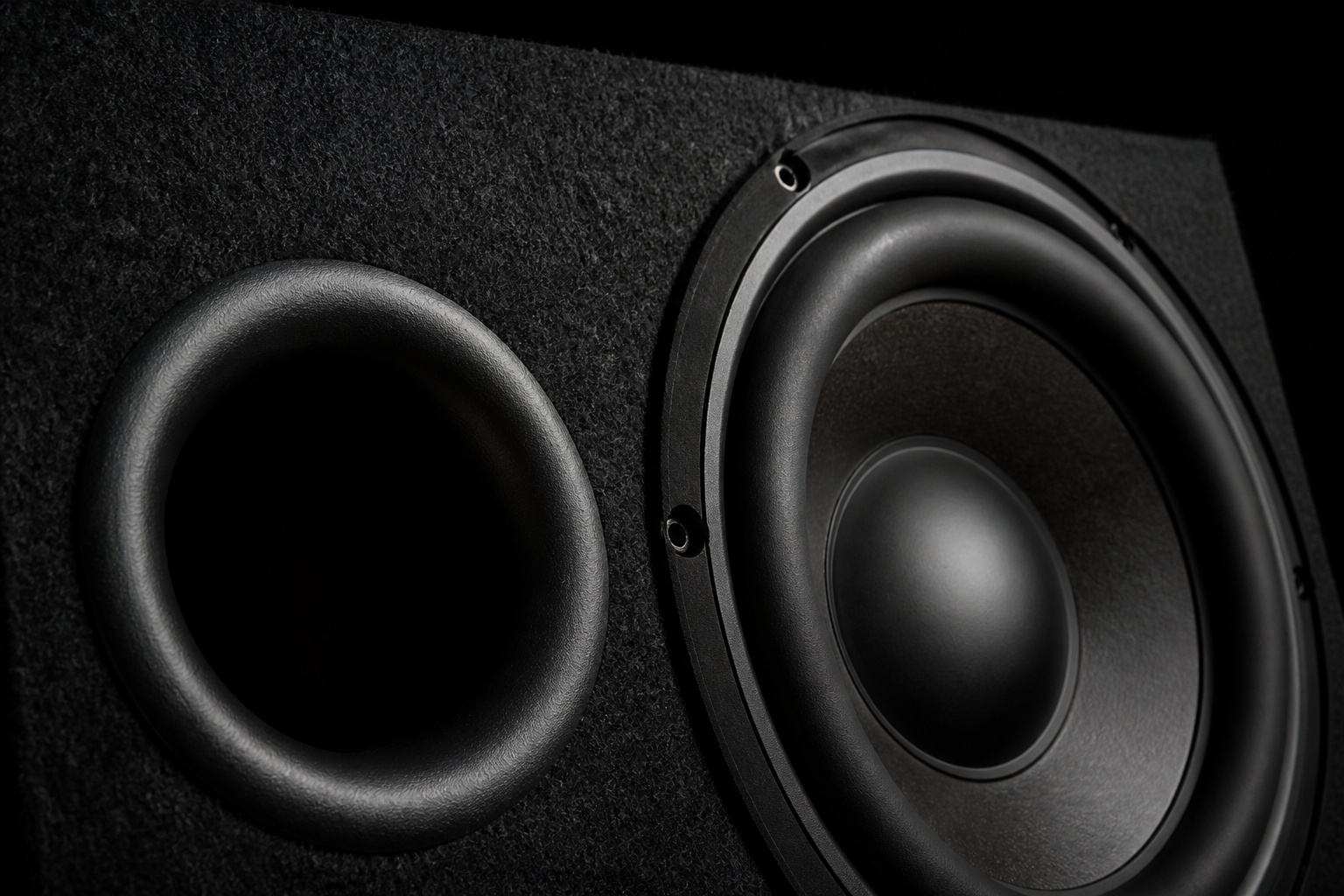 Ported subwoofer enclosure showing the port opening
