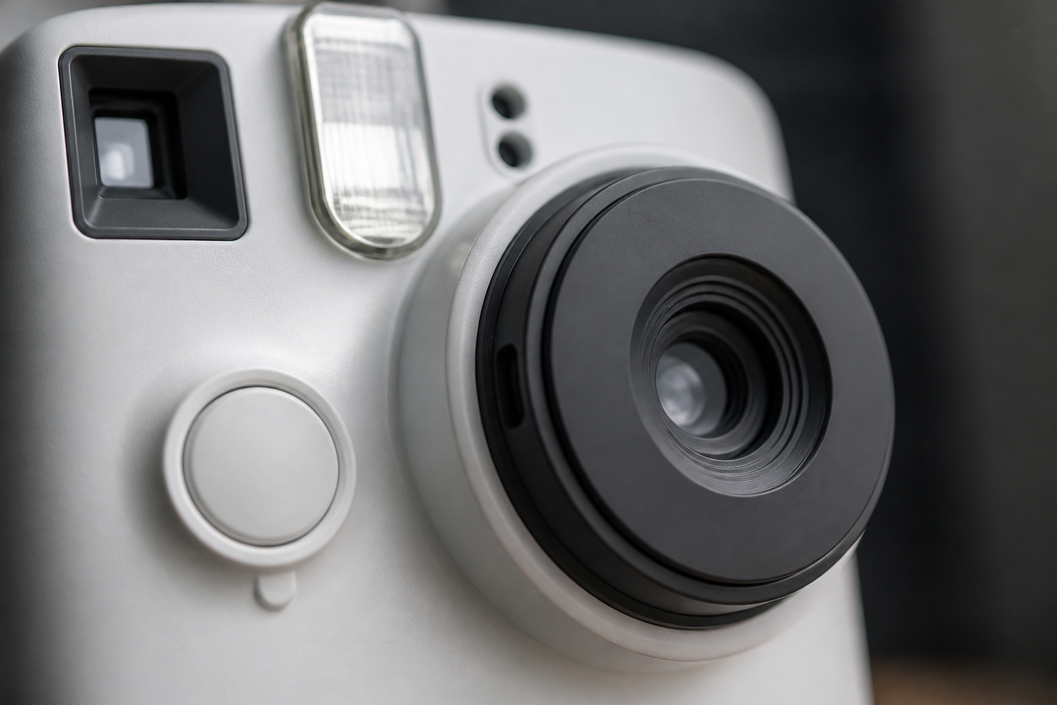 Close-up of an instant camera lens and viewfinder